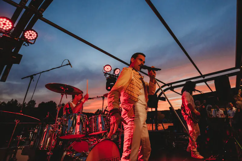 Live band playing on the deck of a boat at sunset